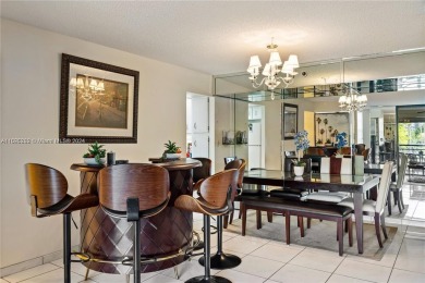 Lovely condo offers a perfect blend of comfort and convenience on Pembroke Lakes Golf Club in Florida - for sale on GolfHomes.com, golf home, golf lot