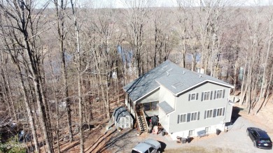 Wake up to the sounds of nature, unwind by the fire, and take in on The Hideout Golf in Pennsylvania - for sale on GolfHomes.com, golf home, golf lot