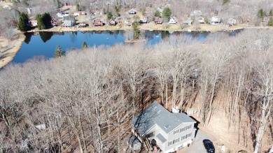 Wake up to the sounds of nature, unwind by the fire, and take in on The Hideout Golf in Pennsylvania - for sale on GolfHomes.com, golf home, golf lot