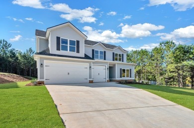 Nestled on the corner lot is an absolute gorgeous new on Canongate At Healy Point Country Club in Georgia - for sale on GolfHomes.com, golf home, golf lot