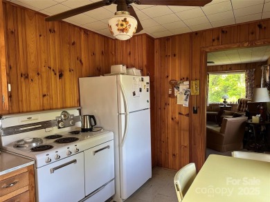 Nestled in the serene beauty of Lake Junaluska, this charming on Lake Junaluska Golf Course in North Carolina - for sale on GolfHomes.com, golf home, golf lot