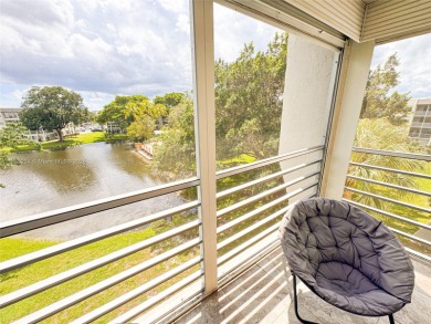 Updated top-floor 2BD/2BA condo with stunning lake views in the on Pine Island Ridge Country Club in Florida - for sale on GolfHomes.com, golf home, golf lot