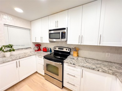 Updated top-floor 2BD/2BA condo with stunning lake views in the on Pine Island Ridge Country Club in Florida - for sale on GolfHomes.com, golf home, golf lot