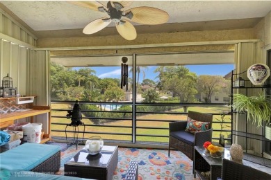 Remodeled 2/2 condo that lives like a home - Impact windows and on Woodmont Country Club in Florida - for sale on GolfHomes.com, golf home, golf lot