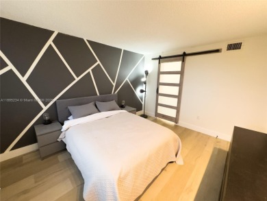 Updated top-floor 2BD/2BA condo with stunning lake views in the on Pine Island Ridge Country Club in Florida - for sale on GolfHomes.com, golf home, golf lot