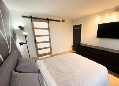 Updated top-floor 2BD/2BA condo with stunning lake views in the on Pine Island Ridge Country Club in Florida - for sale on GolfHomes.com, golf home, golf lot