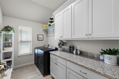 This beautifully designed home offers a blend of modern on Pecan Plantation Country Club in Texas - for sale on GolfHomes.com, golf home, golf lot