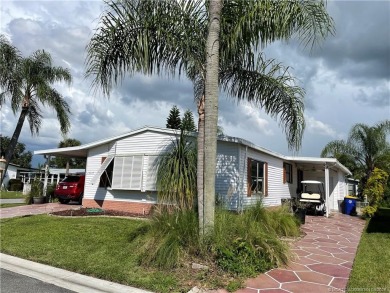This charming residence boasts numerous delightful features. 2 on Indianwood Golf and Country Club in Florida - for sale on GolfHomes.com, golf home, golf lot