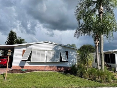This charming residence boasts numerous delightful features. 2 on Indianwood Golf and Country Club in Florida - for sale on GolfHomes.com, golf home, golf lot