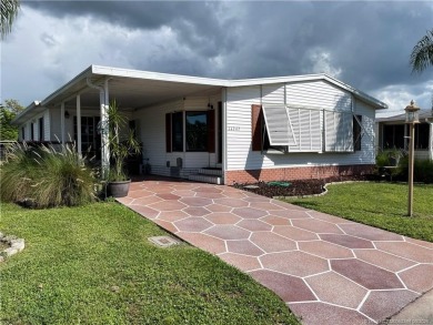 This charming residence boasts numerous delightful features. 2 on Indianwood Golf and Country Club in Florida - for sale on GolfHomes.com, golf home, golf lot