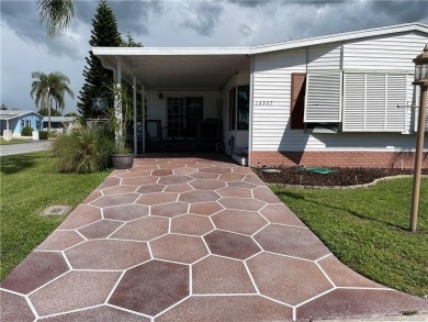 This charming residence boasts numerous delightful features. 2 on Indianwood Golf and Country Club in Florida - for sale on GolfHomes.com, golf home, golf lot