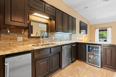 Private paradise nestled along the river with water views on Pecan Plantation Country Club in Texas - for sale on GolfHomes.com, golf home, golf lot