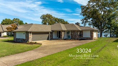 33024 Mockingbird Lane is a striking lakefront retreat that on The Coves Golf Course in Oklahoma - for sale on GolfHomes.com, golf home, golf lot