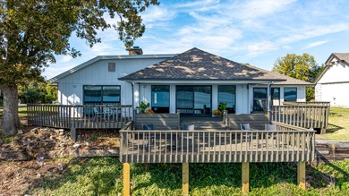 33024 Mockingbird Lane is a striking lakefront retreat that on The Coves Golf Course in Oklahoma - for sale on GolfHomes.com, golf home, golf lot