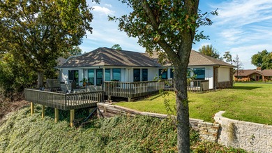 33024 Mockingbird Lane is a striking lakefront retreat that on The Coves Golf Course in Oklahoma - for sale on GolfHomes.com, golf home, golf lot