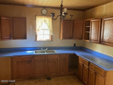 Tired of sitting on your couch watching others on tv renovating on Four Oaks Golf Course in Kansas - for sale on GolfHomes.com, golf home, golf lot