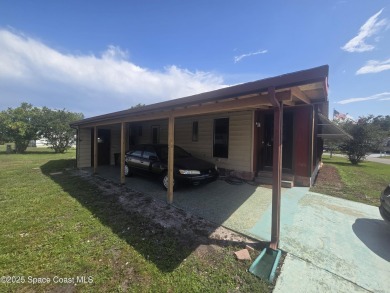 Partially renovated home is ready for handy owners or landlord on Barefoot Bay Golf Course in Florida - for sale on GolfHomes.com, golf home, golf lot