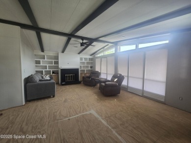 Partially renovated home is ready for handy owners or landlord on Barefoot Bay Golf Course in Florida - for sale on GolfHomes.com, golf home, golf lot