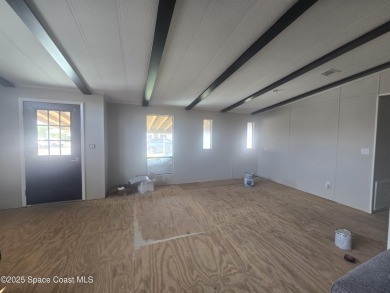 Partially renovated home is ready for handy owners or landlord on Barefoot Bay Golf Course in Florida - for sale on GolfHomes.com, golf home, golf lot