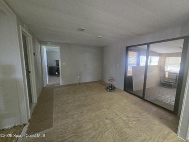 Partially renovated home is ready for handy owners or landlord on Barefoot Bay Golf Course in Florida - for sale on GolfHomes.com, golf home, golf lot
