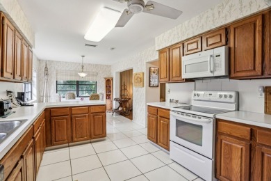 Spacious and well-built 3/2 home on prime oversized lot backing on Pine Tree Golf Club in Florida - for sale on GolfHomes.com, golf home, golf lot