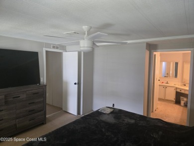 Partially renovated home is ready for handy owners or landlord on Barefoot Bay Golf Course in Florida - for sale on GolfHomes.com, golf home, golf lot