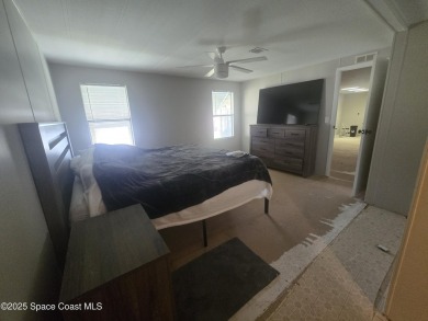 Partially renovated home is ready for handy owners or landlord on Barefoot Bay Golf Course in Florida - for sale on GolfHomes.com, golf home, golf lot