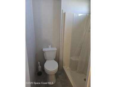 Partially renovated home is ready for handy owners or landlord on Barefoot Bay Golf Course in Florida - for sale on GolfHomes.com, golf home, golf lot