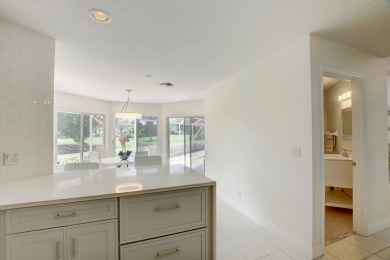 One level 4 bedroom 3 bath home with vaulted ceilings and on Boca Greens Country Club in Florida - for sale on GolfHomes.com, golf home, golf lot