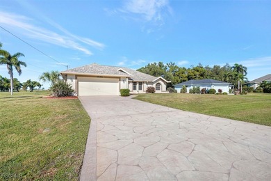 Welcome to your Florida dream home! Tucked away on a quiet on Coral Oaks Golf Course in Florida - for sale on GolfHomes.com, golf home, golf lot