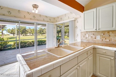 Welcome to your Florida dream home! Tucked away on a quiet on Coral Oaks Golf Course in Florida - for sale on GolfHomes.com, golf home, golf lot