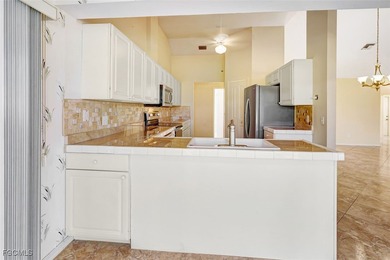 Welcome to your Florida dream home! Tucked away on a quiet on Coral Oaks Golf Course in Florida - for sale on GolfHomes.com, golf home, golf lot