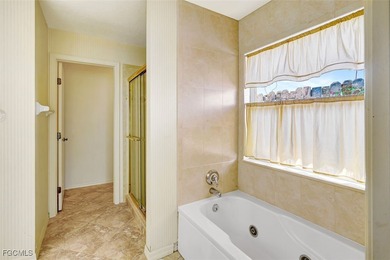 Welcome to your Florida dream home! Tucked away on a quiet on Coral Oaks Golf Course in Florida - for sale on GolfHomes.com, golf home, golf lot