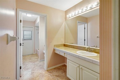 Welcome to your Florida dream home! Tucked away on a quiet on Coral Oaks Golf Course in Florida - for sale on GolfHomes.com, golf home, golf lot