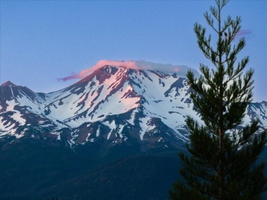 Sentinel Retreat rises boldly from its ridge-top setting above on Mount Shasta Resort in California - for sale on GolfHomes.com, golf home, golf lot