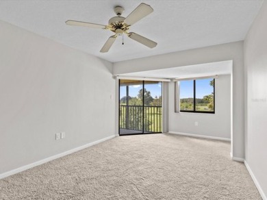 Discover the epitome of condominium living in this bright and on Tarpon Springs Golf Course in Florida - for sale on GolfHomes.com, golf home, golf lot