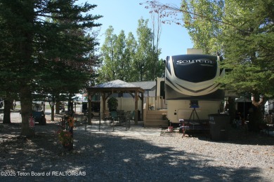 Extra large corner lot, with mature trees.  2021 36 foot Grand on Star Valley RV Golf Course in Wyoming - for sale on GolfHomes.com, golf home, golf lot
