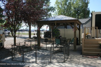 Extra large corner lot, with mature trees.  2021 36 foot Grand on Star Valley RV Golf Course in Wyoming - for sale on GolfHomes.com, golf home, golf lot