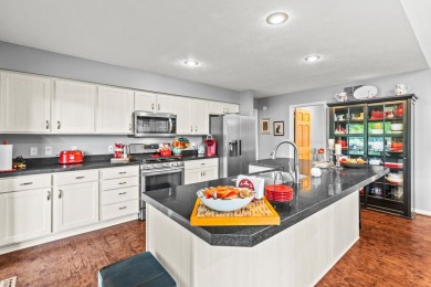 Welcome to your dream home in Canadian Lakes, perfectly situated on Canadian Lakes Country Club-The Royal Course in Michigan - for sale on GolfHomes.com, golf home, golf lot