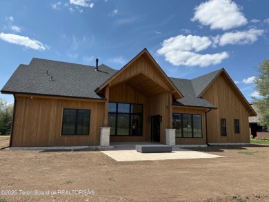 Welcome to your dream oasis nestled within the prestigious Teton on Teton Springs Resort and Club in Idaho - for sale on GolfHomes.com, golf home, golf lot