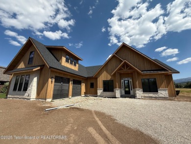 Welcome to your dream oasis nestled within the prestigious Teton on Teton Springs Resort and Club in Idaho - for sale on GolfHomes.com, golf home, golf lot