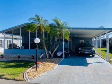 This home is in a 55 plus senior park with a monthly lot rent of on Crystal Lake Club in Florida - for sale on GolfHomes.com, golf home, golf lot