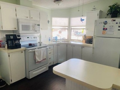 This home is in a 55 plus senior park with a monthly lot rent of on Crystal Lake Club in Florida - for sale on GolfHomes.com, golf home, golf lot