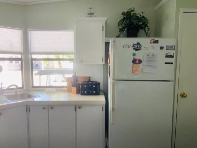 This home is in a 55 plus senior park with a monthly lot rent of on Crystal Lake Club in Florida - for sale on GolfHomes.com, golf home, golf lot