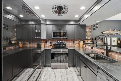 You have to come take a look at this beautifully renovated top on Plantation Inn and Golf Resort  in Florida - for sale on GolfHomes.com, golf home, golf lot