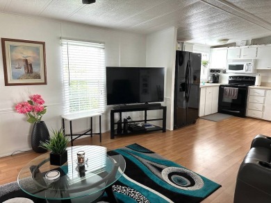 BEAUTIFULLY MAINTAINED FULLY FURNISHED 2-BEDROOM, 2-BATHROOM on Anglers Green Golf Course in Florida - for sale on GolfHomes.com, golf home, golf lot
