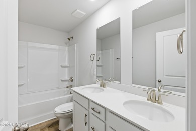 The Kent is a stunning open-concept home designed for effortless on Harbour Point Golf Club in North Carolina - for sale on GolfHomes.com, golf home, golf lot