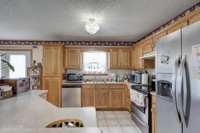 Welcome to this well-maintained, move-in ready 3-bedroom, 2-bath on Twin Hills Golf and Country Club in Missouri - for sale on GolfHomes.com, golf home, golf lot