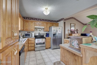 Welcome to this well-maintained, move-in ready 3-bedroom, 2-bath on Twin Hills Golf and Country Club in Missouri - for sale on GolfHomes.com, golf home, golf lot