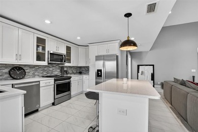 Rarely available two-bedroom, two-bath villa in the Peppertree on Boca West Golf and Country Club in Florida - for sale on GolfHomes.com, golf home, golf lot